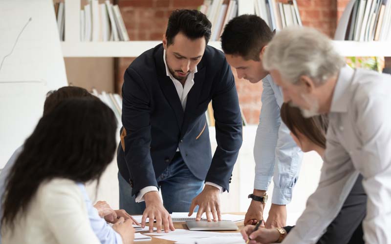 Group of people looking at documents