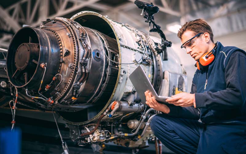 Man working on a jet engine