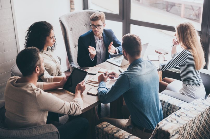 A group of business people around a table