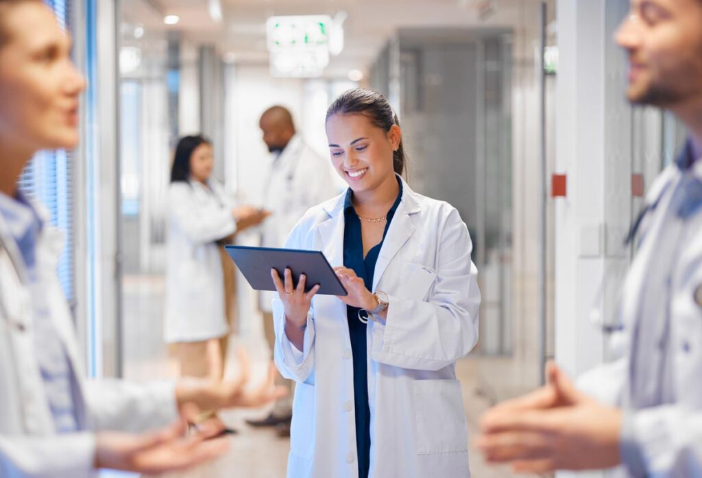 A doctor working on a tablet