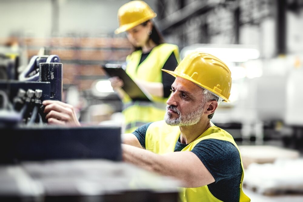 Two workers in a warehouse