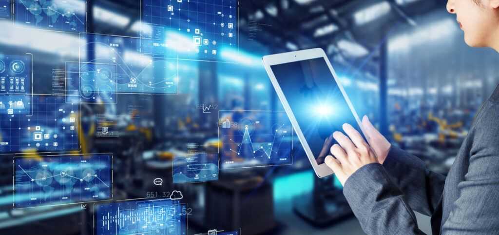 An engineer using a tablet in a factory