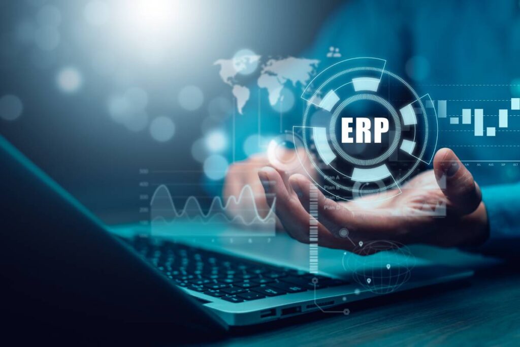 A man using ERP software on a laptop.