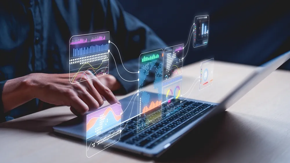 A man looking at data on his laptop.